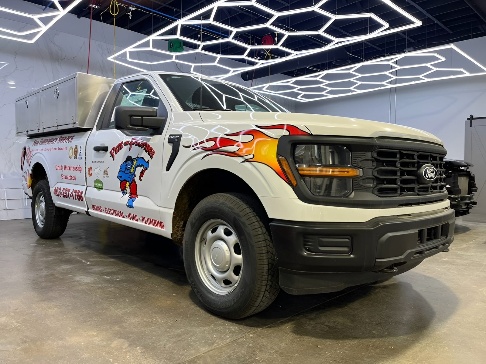 Trades and service vehicle with KingSkinz fleet graphics